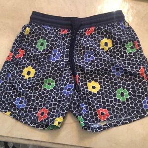 Swim trunks by Vilebrequin + Madhappy. Black with red &yellow flowers.sz M